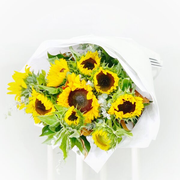 Sunflowers by the bunch wrapped inpaper